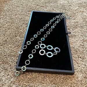 Lia Sophia oyster shell like long necklace with matching bracelet.